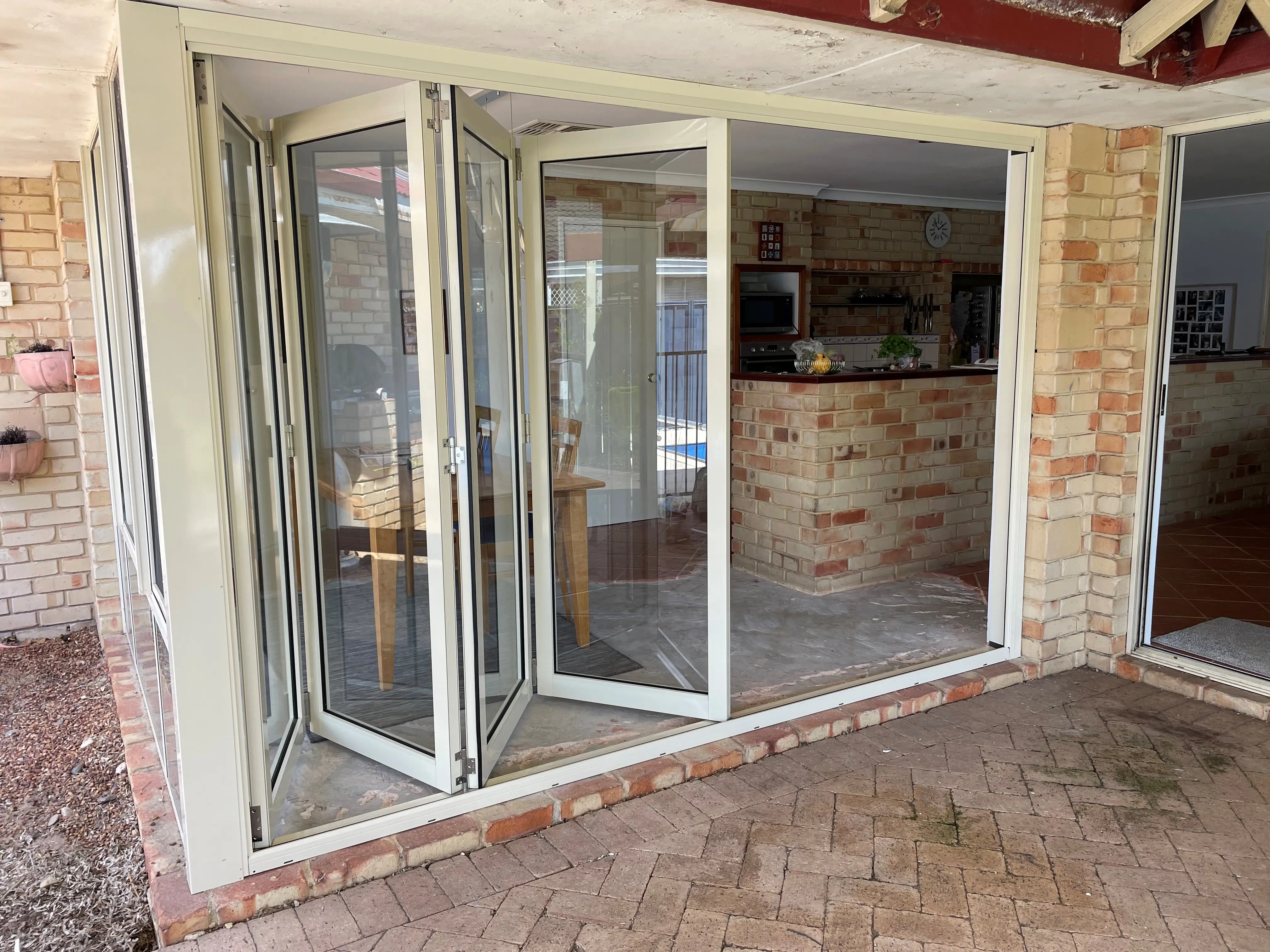 sliding vs bifold doors - bifold in white