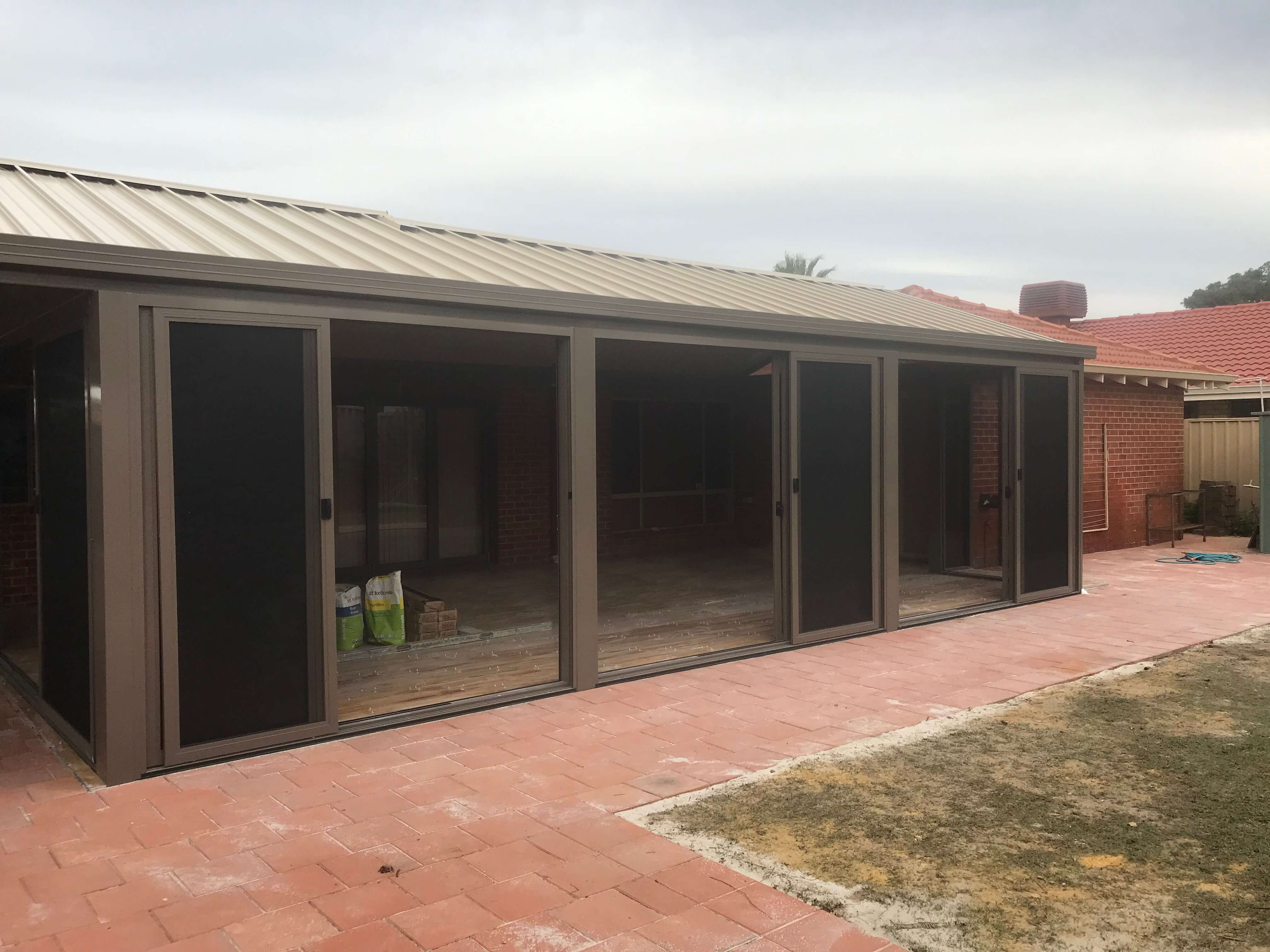 3 Panel STACKING DOOR W FLYSCREENS Patio Enclosure 2.jpeg